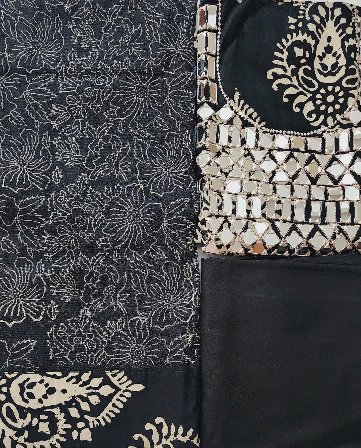 Black fabric with white floral patterns